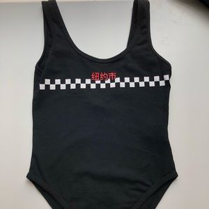 black open back body suit w/graphic across chest